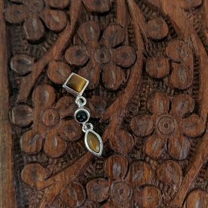 Sterling silver pendant with tiger's eye and onyx